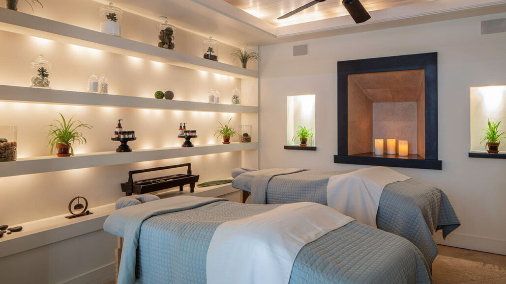 Two massage tables surround with serene lighting