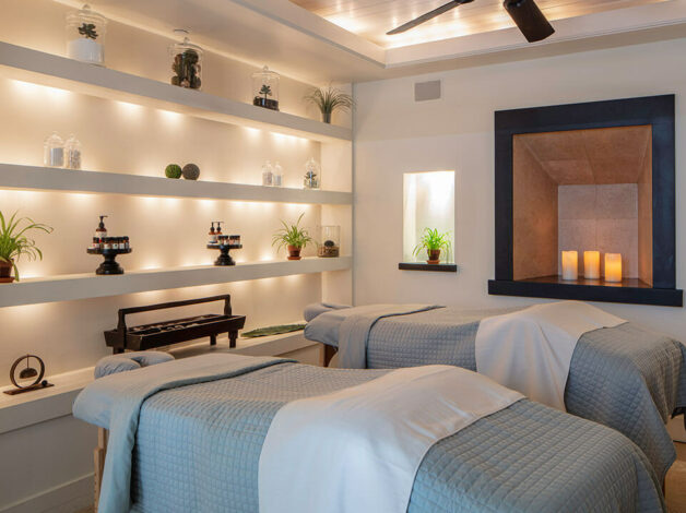 Two massage tables surround with serene lighting